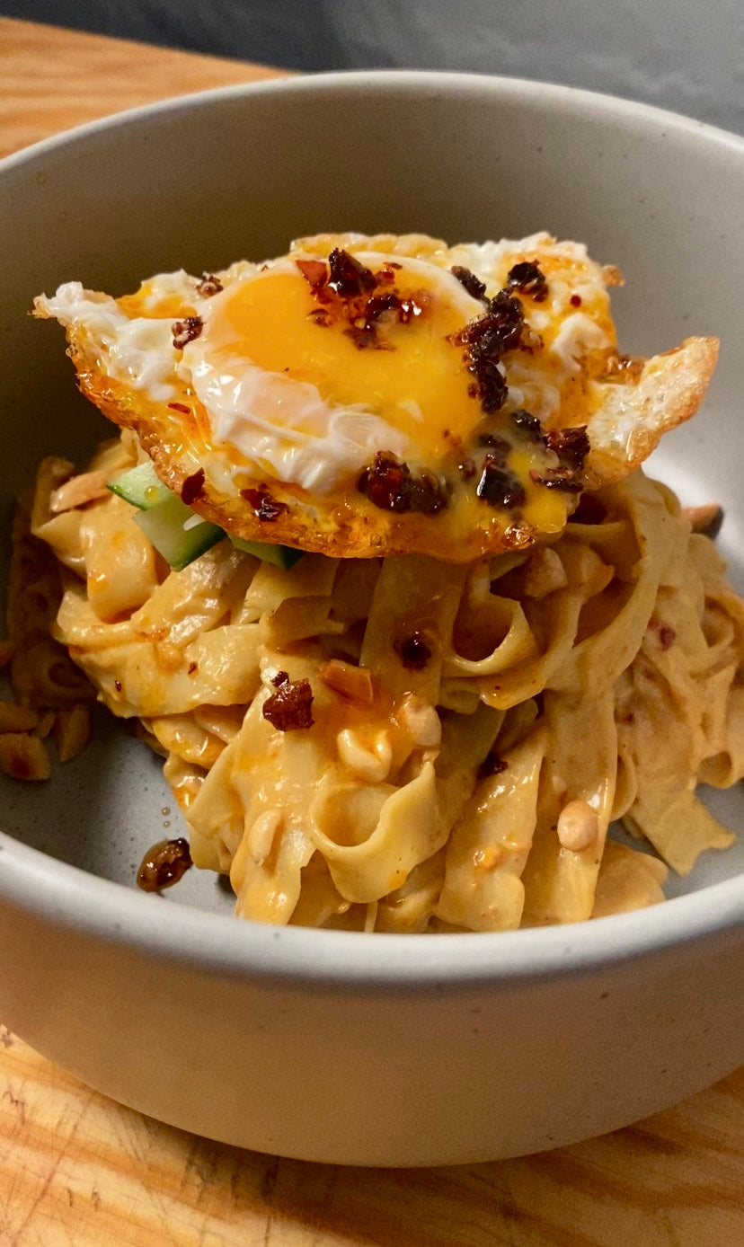 satay umami noodles in a bowl