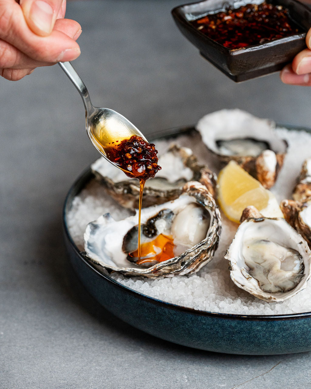 Oyster with UmamiPapi Crispy Chilli OIl