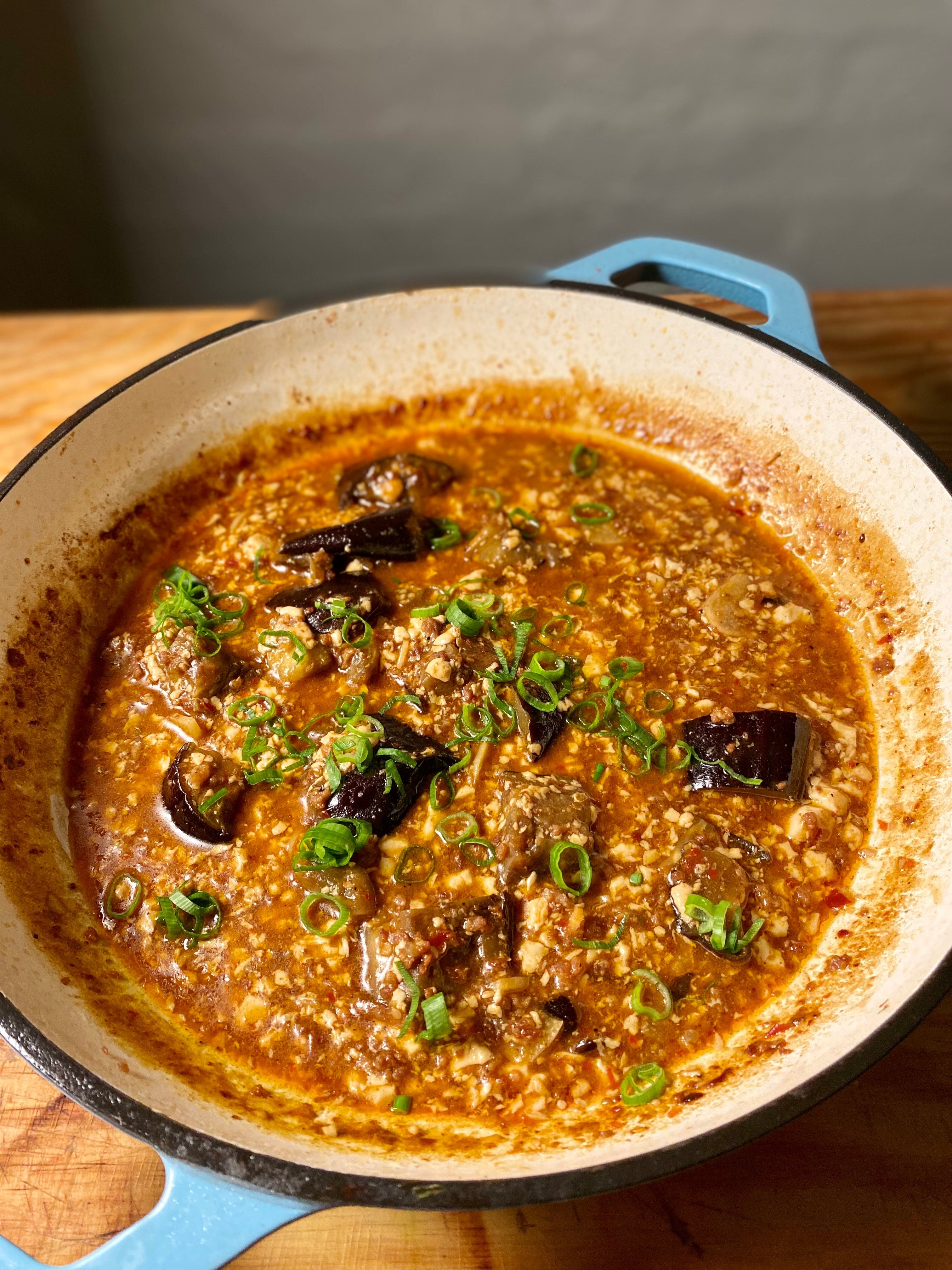 a bowl of mapo with umami tofu, pork mince and eggplant
